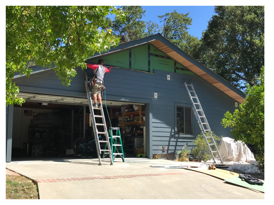 Jack Cooper from RPS Remodeling working on exterior siding