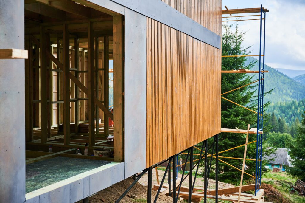 Wood siding being installed on a house