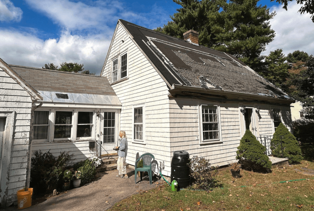 Before image of a home’s exterior, showing its original roofing and siding prior to a renovation using the Renoworks Visualizer.